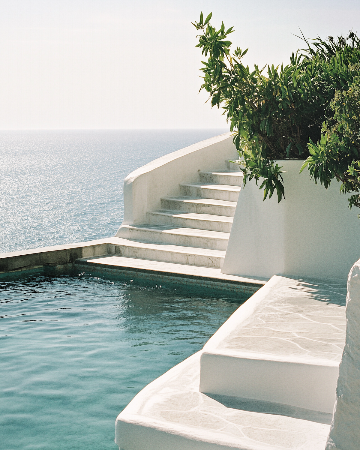 An infinity pool overlooking the ocean at a quiet resort